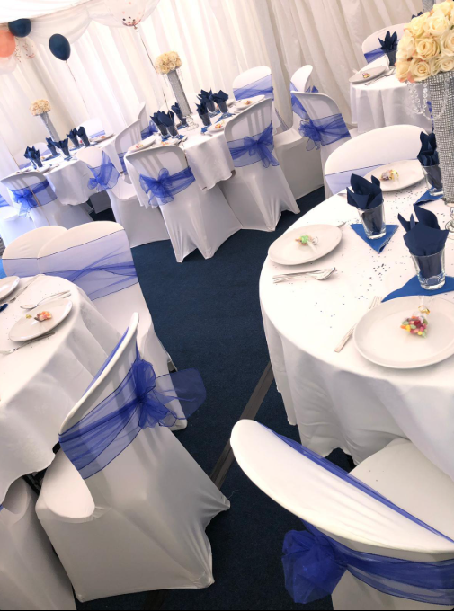 1 White marquee with blue interior and balloons