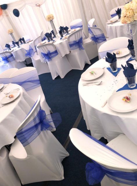 White marquee with blue interior and balloons