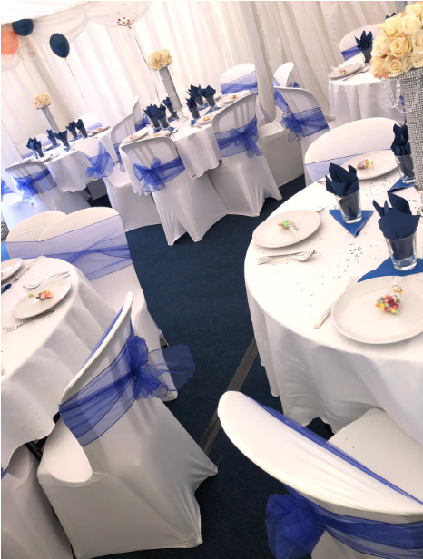 White marquee with blue interior and balloons